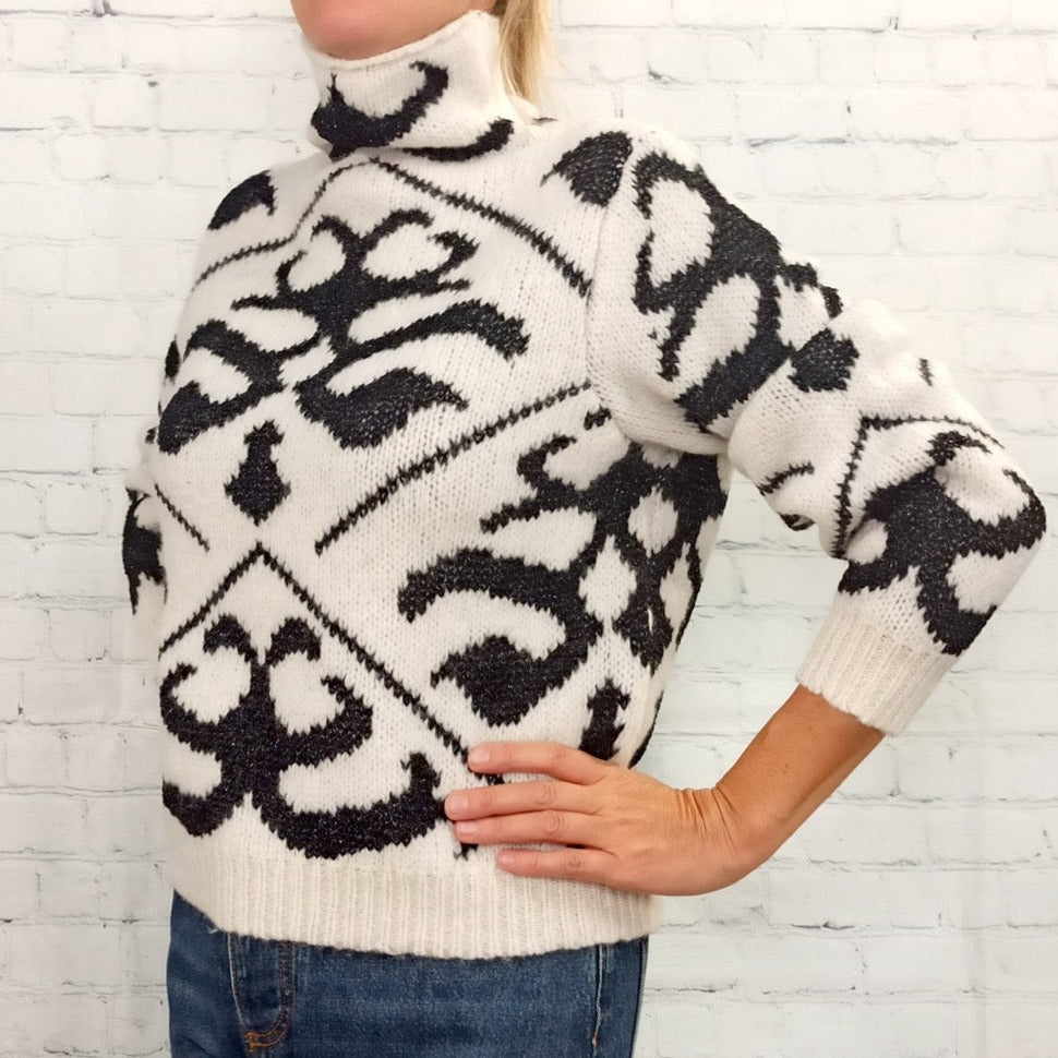 Maglione a collo alto geometrico bianco